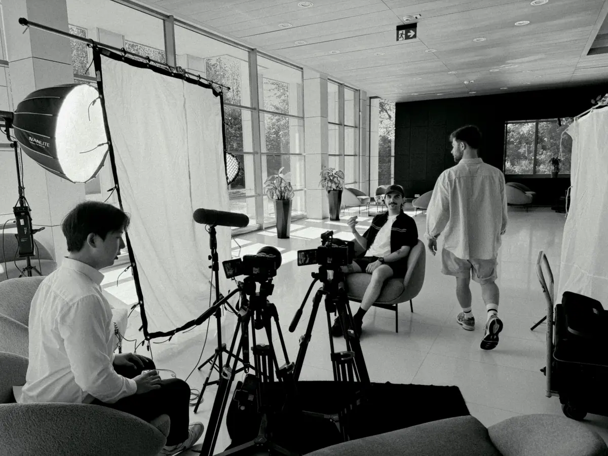Represent crew filming an interview in a New York office
