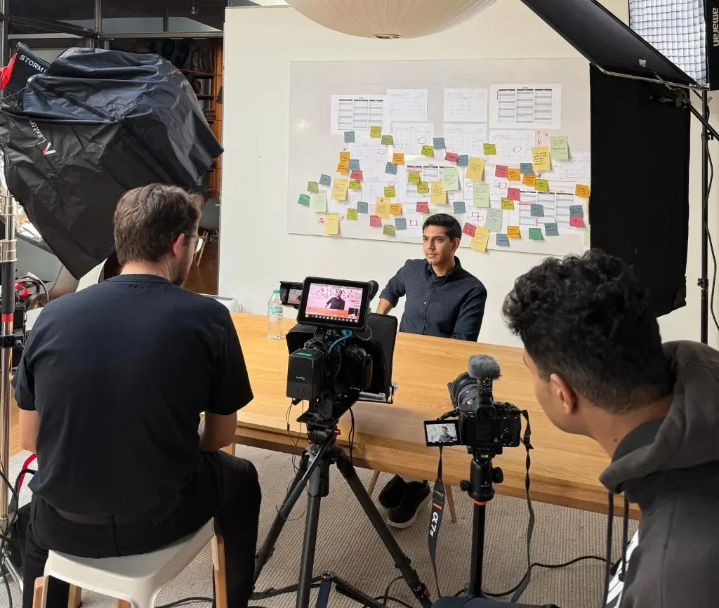 Represent crew filming an interview on set