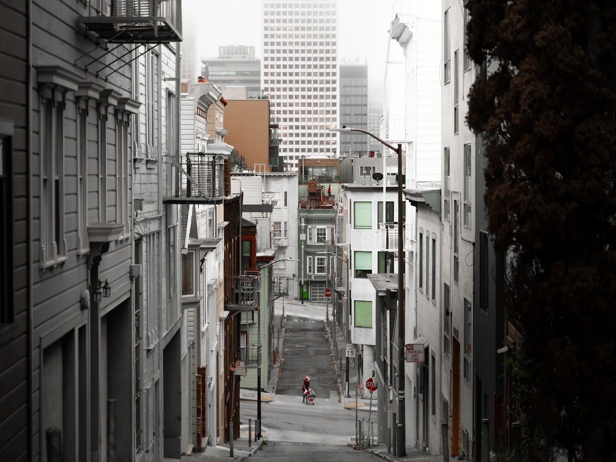 Steep San Francisco street with downtown towers in the fog, where Represent films on location